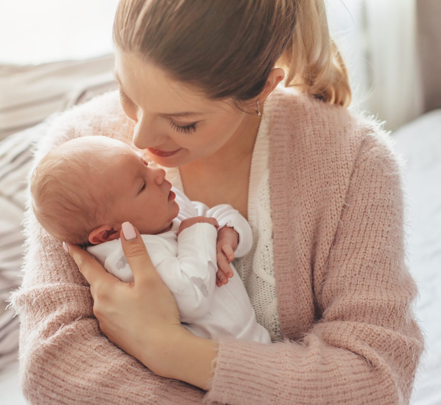 young mother holding her baby